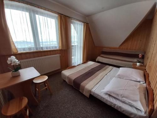 Cama o camas de una habitación en Niebiańska Grań
