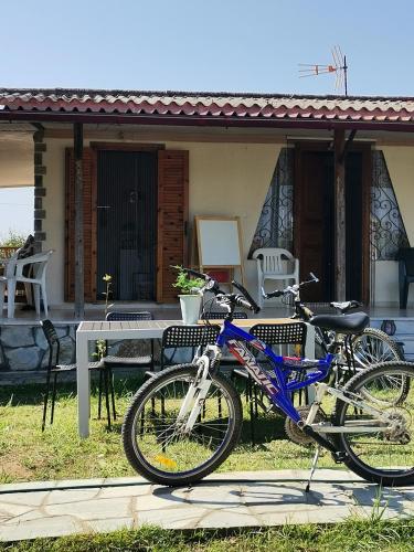 two bikes parked in front of a house at Green Vila in Sozopoli
