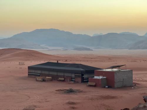 a building in the middle of the desert at Wadi Rum Desert Adventures in Wadi Rum