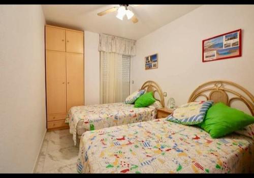 Posteľ alebo postele v izbe v ubytovaní Apartamento la isla