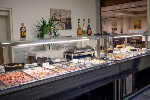 a buffet line with many different types of food at Landhotel Stüer in Altenberge