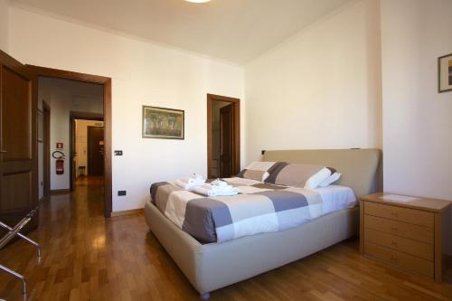 Cama o camas de una habitación en Residenza Aletheia - 2BR with Saint Peter's view