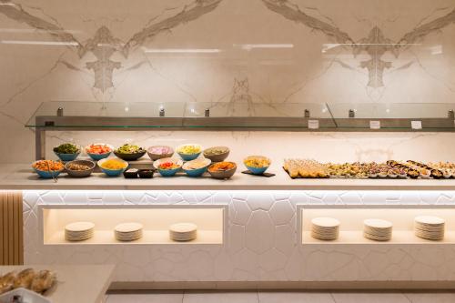 a buffet with many different types of food on display at Gran Sagitario in Ciutadella