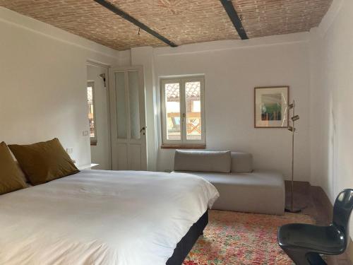 מיטה או מיטות בחדר ב-Casa Dormiveglia