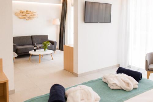 a person laying on a couch in a living room at Gran Sagitario in Ciutadella
