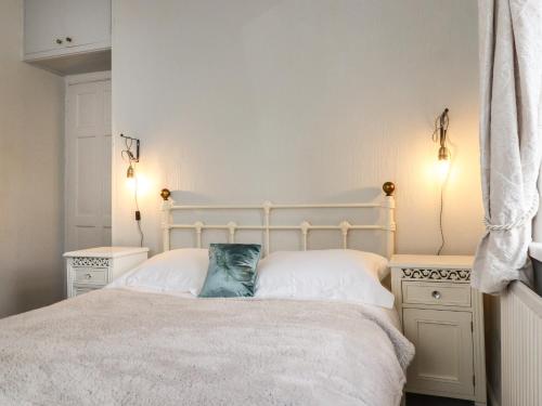 En eller flere senge i et værelse på Teddy Bear Cottage