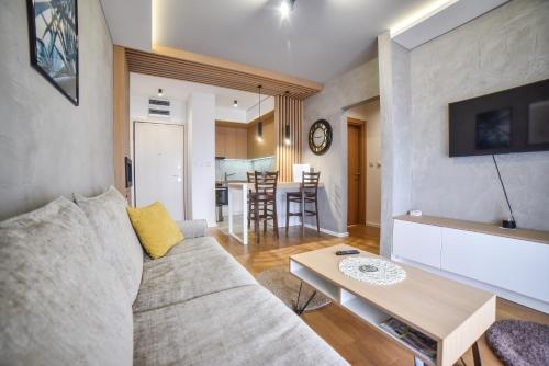a living room with a couch and a table at Balkan Hill Zlatibor in Zlatibor