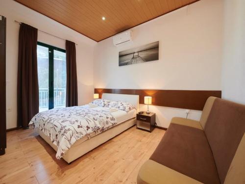 Postel nebo postele na pokoji v ubytování Apartments Vujina