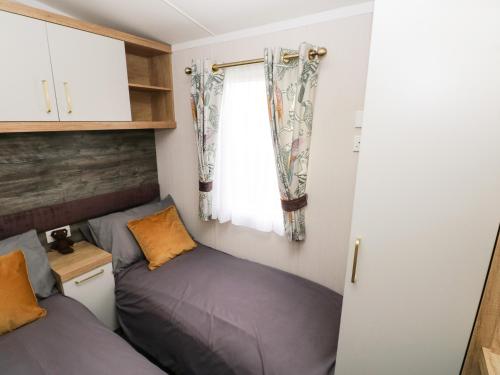 Кровать или кровати в номере Castleview 22