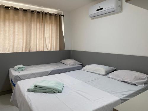 Lova arba lovos apgyvendinimo įstaigoje Condomínio Veranno di Porto AP 104