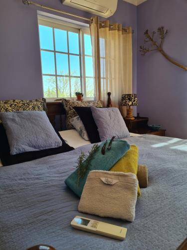 A bed or beds in a room at Casa dos Ventos