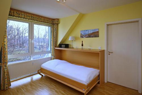 Postel nebo postele na pokoji v ubytování Residenz Seestern Wohnung 42