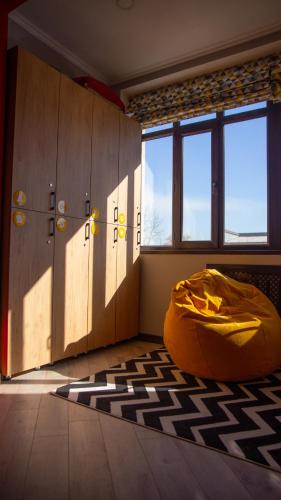 a room with a bed in the middle of a room at People Hostel in Bishkek