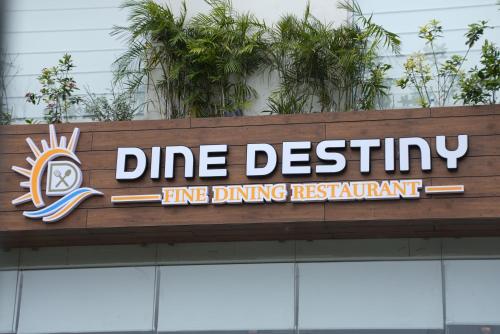 a sign for a line dining restaurant on top of a building at HOTEL OCEAN VISTA BAY in Visakhapatnam