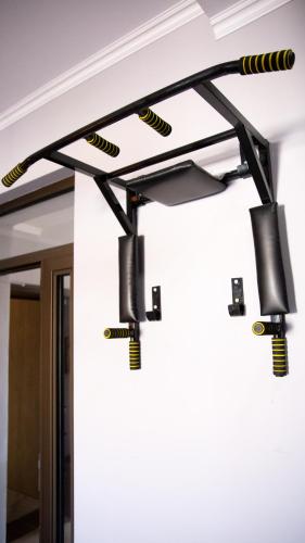a track light hanging from the ceiling of a room at People Hostel in Bishkek