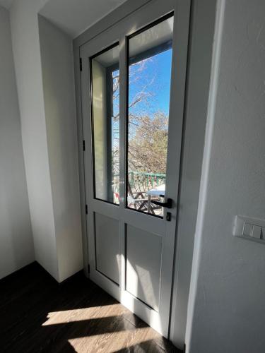 an open door with a window in a room at Villa Tergeste in Trieste