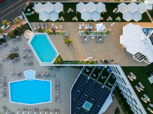 an overhead view of a swimming pool in a resort at MYND Adeje in Adeje