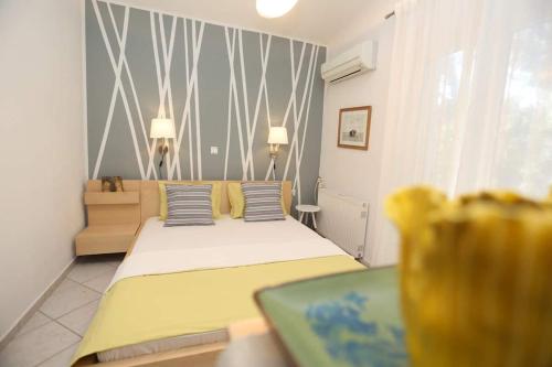 Ένα ή περισσότερα κρεβάτια σε δωμάτιο στο Villa Asterios