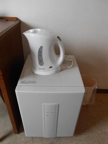 a white blender sitting on top of a box at Select Inn Mishima in Mishima