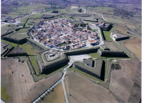an aerial view of a large city with buildings at A Muralha in Almeida