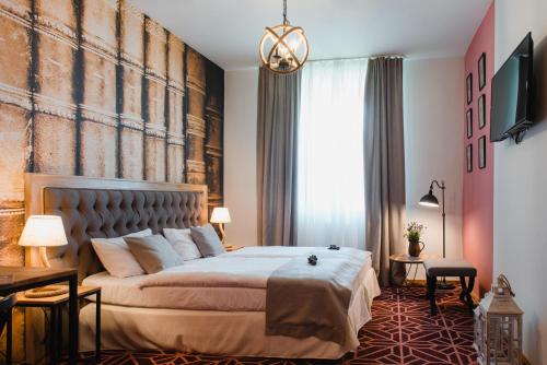 Postel nebo postele na pokoji v ubytování Hotel Podklasztorze
