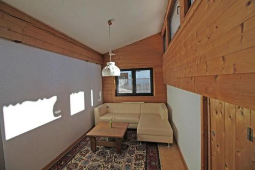 a living room with a couch and a table at Haus Gerdi in Söll