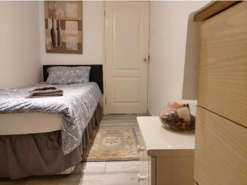 a small bedroom with a bed and a kitchen at Amazing Double Liverpool in Liverpool