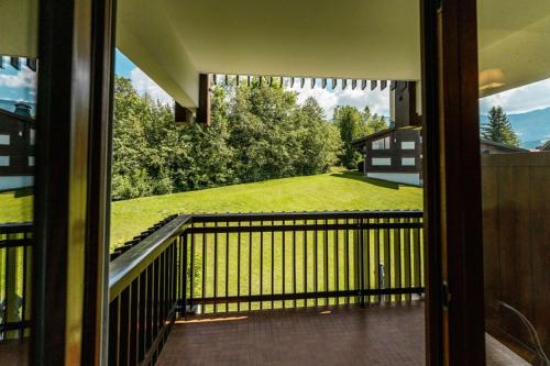a balcony with a view of a yard at Studio with balcony and views of the golf course and surrounding mountains in Megève