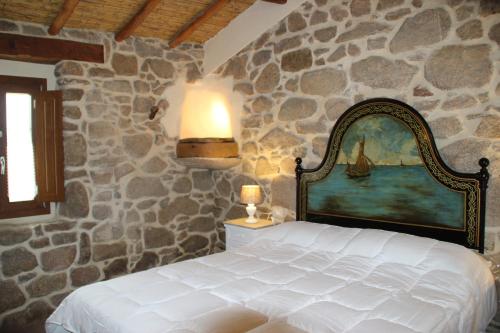 Un pat sau paturi într-o cameră la Stazzo Gallurese La Cugara