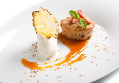 a dessert on a white plate with a desert at Viking Line ferry Gabriella - One-way journey from Helsinki to Stockholm in Helsinki