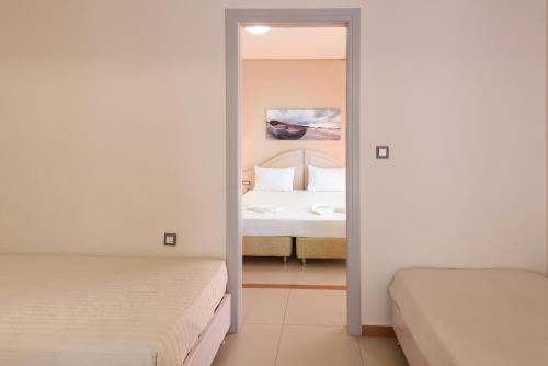 Hotel Poseidonにあるベッド