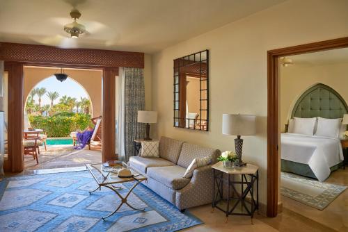 a living room with a couch and a bed at Four Seasons Resort Sharm El Sheikh in Sharm El Sheikh