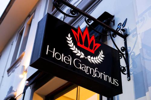 a sign on the side of a hotel gennaissance building at Hotel Gambrinus in Poços de Caldas