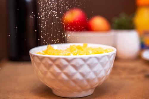 a bowl of food sitting on top of a counter at Hotel Gambrinus in Poços de Caldas
