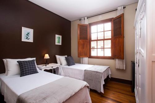 Postel nebo postele na pokoji v ubytování Hotel Gambrinus