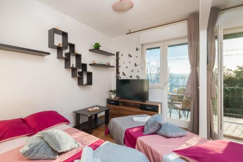 Postel nebo postele na pokoji v ubytování Beach Apartment Milena