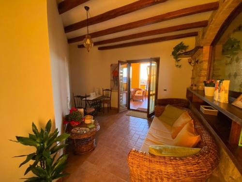 a living room with a couch and a table at Alloggio turistico La Maison de Matì in Monterotondo