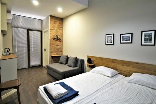 Postel nebo postele na pokoji v ubytování Hotel Loft