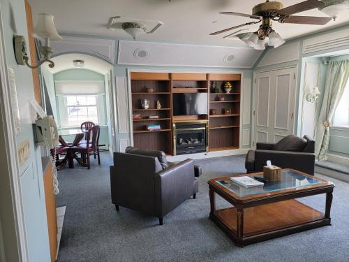 a living room with a couch and a table at Lowell Inn in Stillwater