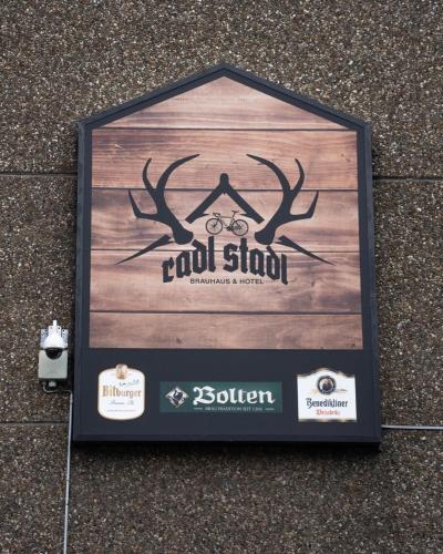 a sign for a cool shop with antlers on it at RadlStadl - Brauhaus und Hotel in Kaarst