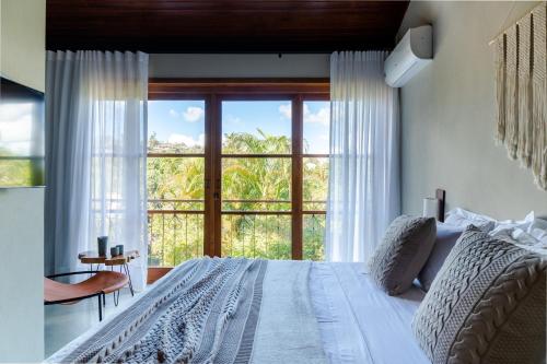 Giường trong phòng chung tại Refúgio na Serra Boutique Hotel