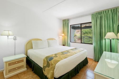 Postel nebo postele na pokoji v ubytování Belair Beach Hotel
