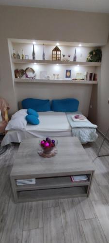 a room with a bed and a table in it at SOTIRIA APARTMENT in Kiáton