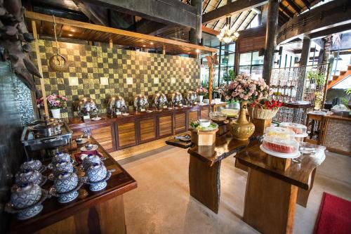 a room with a counter with vases on it at Andalay Beach Resort Koh Libong in Ko Libong