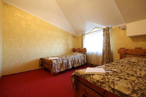 Chagari Hotel tesisinde bir odada yatak veya yataklar
