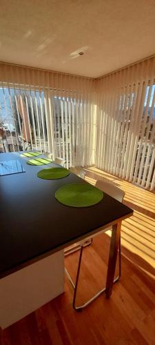 a room with a table with green circles on it at Seeidylle Winkler in Bodensdorf