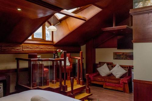 a living room with a couch and a window at Hotel Waynapicchu in Cusco