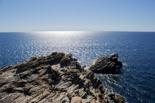 a rock formation in the middle of the ocean at Calascoglietti in Stintino