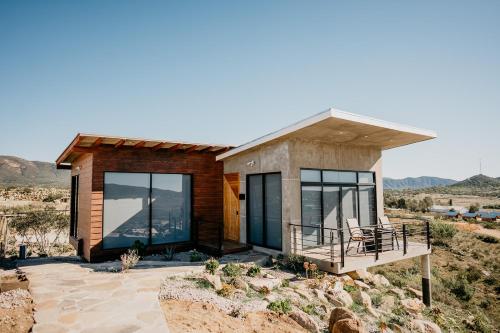 a small house in the middle of the desert at Siempre Valle Hotel Boutique in Valle de Guadalupe