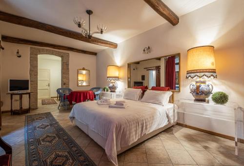 a bedroom with a bed and a large mirror at Corte Cristina in Quartucciu